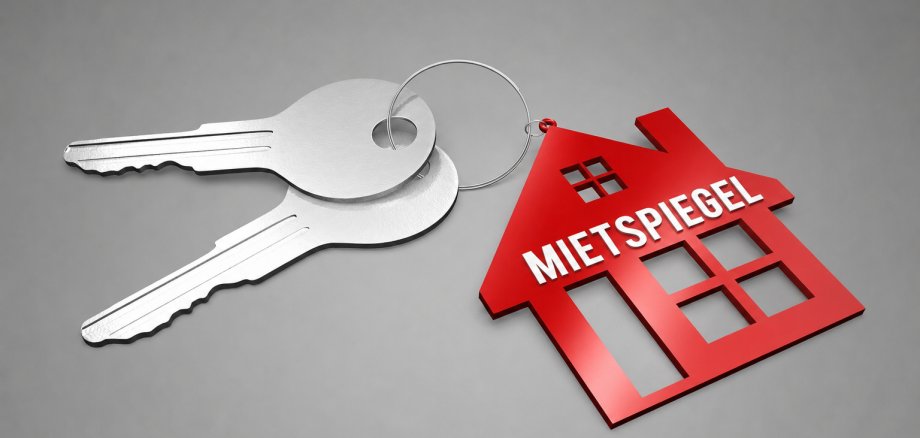 Zwei Schlüssel mit einem Roten Haus als Anhänger auf dem "Mietspiegel" steht.
